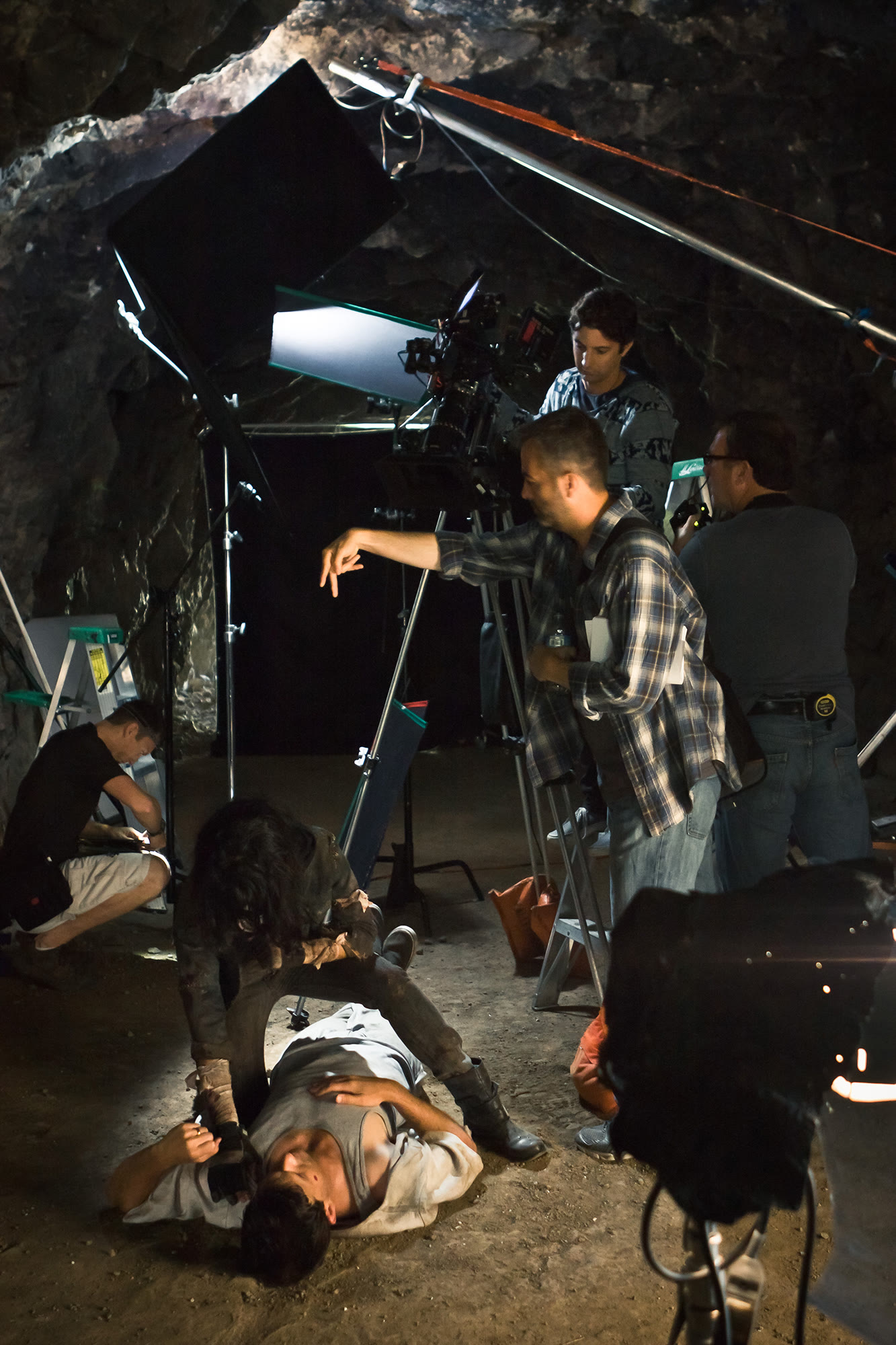 Camera and lighting crew working in the cave.