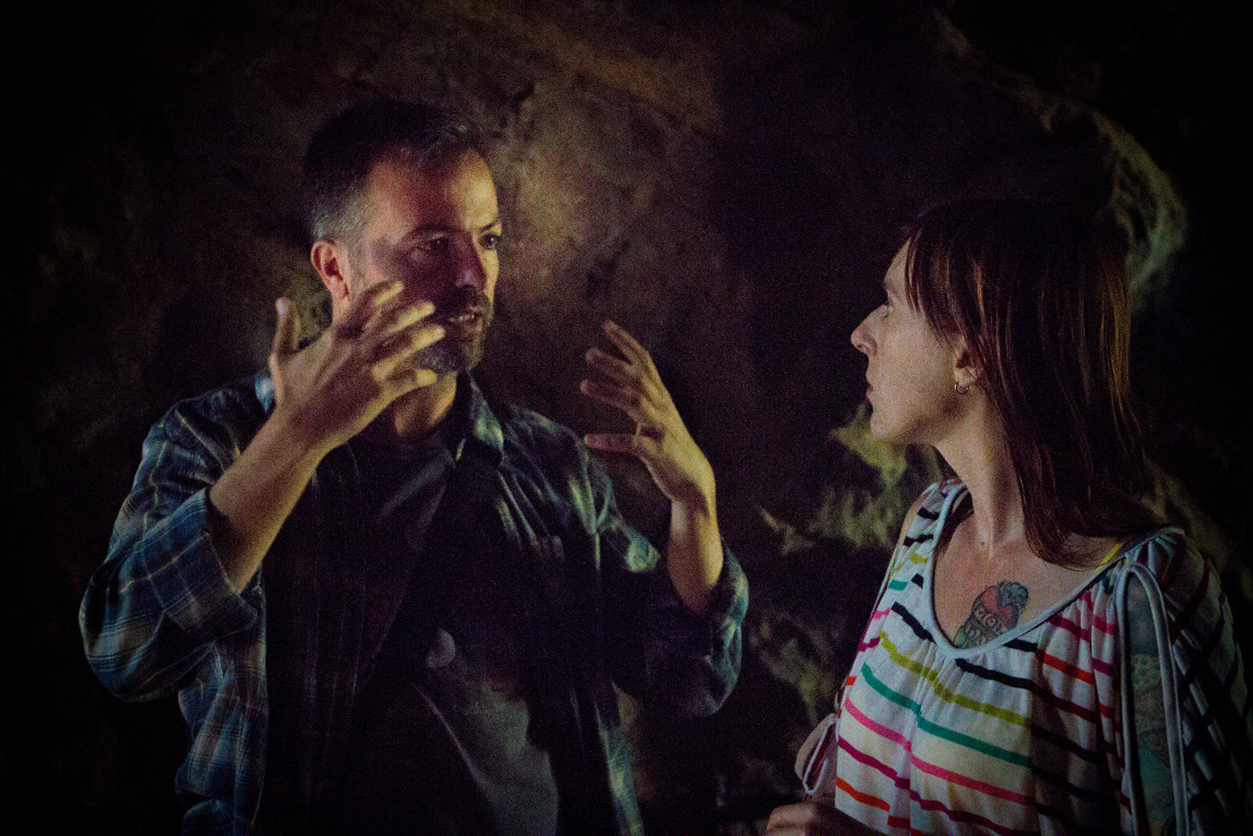 Efram Potelle directing an actress on the cave set.