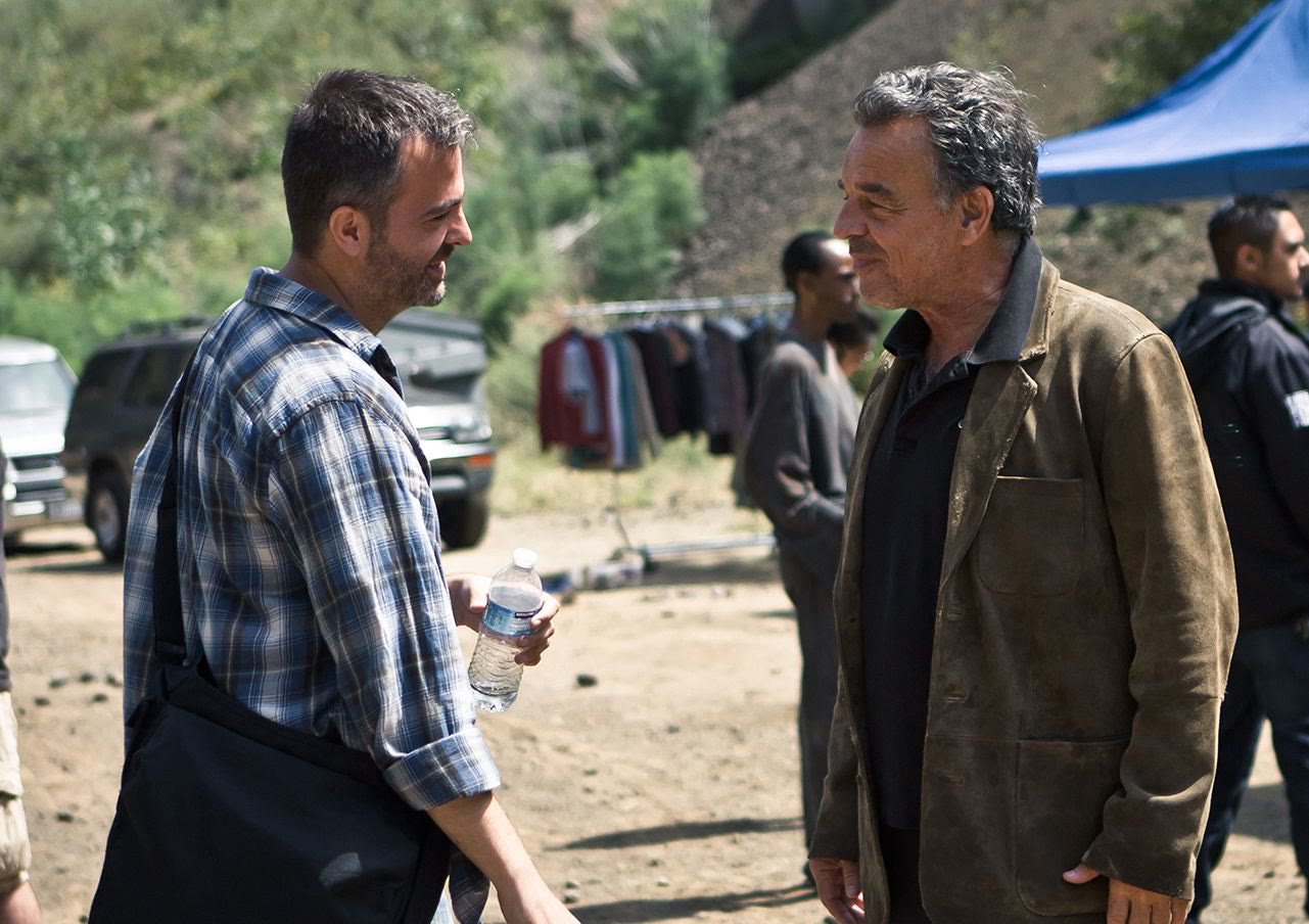 Efram Potelle walking the location with an actor.
