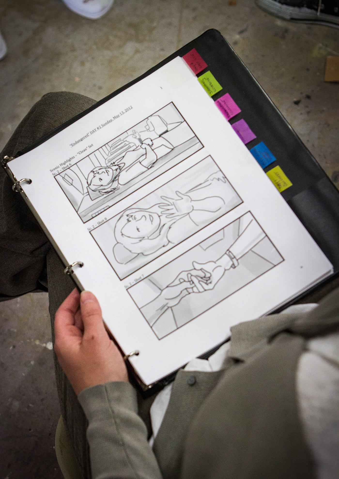 Storyboards open on set during production.