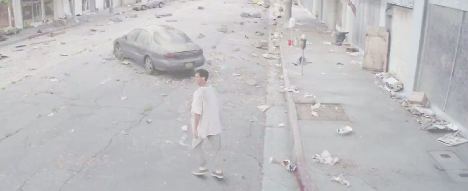 A lone figure on a deserted, overgrown Los Angeles street — a frame from Endangered.
