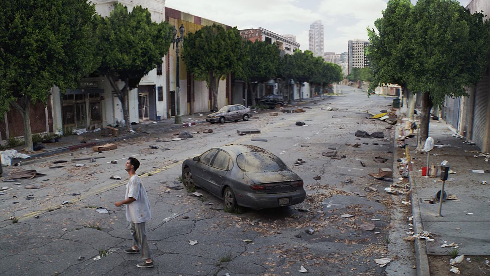 A lone figure on a deserted, overgrown Los Angeles street.